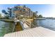 Condo building with waterfront dock and boat access at 4823 Ebbtide Ln # 303, Port Richey, FL 34668