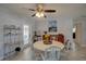 Cozy dining area with a round table, chairs, and adjacent shelving and exterior access at 4934 11Th N Ave, St Petersburg, FL 33710