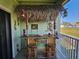 Balcony features an outdoor bar with tiki theming and seating, perfect for entertaining guests at 530 Sandy Hook Rd, Treasure Island, FL 33706
