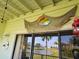 Balcony featuring coastal decor with views overlooking a scenic pond and the waterfront at 530 Sandy Hook Rd, Treasure Island, FL 33706