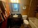 Well-lit bathroom featuring a sleek vanity, mirror and a shower-tub combo at 530 Sandy Hook Rd, Treasure Island, FL 33706