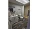 Bathroom featuring a single sink vanity, toilet, and shower/tub combination with tiled floors at 530 Sandy Hook Rd, Treasure Island, FL 33706