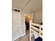 Cozy bedroom area with bunk beds and convenient storage closet, perfect for guests at 530 Sandy Hook Rd, Treasure Island, FL 33706