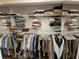 Walk-in closet with an abundance of storage space with metal shelving and hanging rods at 530 Sandy Hook Rd, Treasure Island, FL 33706
