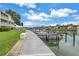 Picturesque waterfront condo community with a dock, boat slips, and serene water views for boating enthusiasts at 530 Sandy Hook Rd, Treasure Island, FL 33706