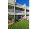 Exterior of the home featuring a backyard and multiple patios with white railings overlooking the landscape at 530 Sandy Hook Rd, Treasure Island, FL 33706