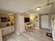 Bright living area features light-colored floors and a small kitchenette at 530 Sandy Hook Rd, Treasure Island, FL 33706