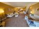 Spacious living room featuring plush carpeting, contemporary decor, and an open floor plan at 530 Sandy Hook Rd, Treasure Island, FL 33706