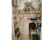 Organized pantry with shelving stocked with various food items and storage containers at 530 Sandy Hook Rd, Treasure Island, FL 33706