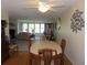Charming dining room with hardwood floors and plenty of natural light at 5660 80Th N St # A205, St Petersburg, FL 33709