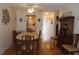 Charming dining room with wood floors, cabinet, and adjacent kitchen access at 5660 80Th N St # A205, St Petersburg, FL 33709