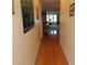 Hallway view with hardwood flooring, leading to the main living area at 5660 80Th N St # A205, St Petersburg, FL 33709