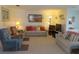 Bright living room showcasing comfortable seating and a tranquil aesthetic at 5660 80Th N St # A205, St Petersburg, FL 33709