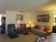 Cozy living room features comfortable seating and decor at 5660 80Th N St # A205, St Petersburg, FL 33709