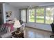 Cozy living area with natural light from large windows overlooking the yard at 5660 80Th N St # A205, St Petersburg, FL 33709