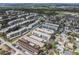 Multi-Gathering aerial view showing the property with a central lake, green space, and convenient access to city amenities at 5967 Terrace Park N Dr # 202, St Petersburg, FL 33709