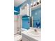 Quirky bathroom with playful ocean-themed decor and a shower-tub combination at 5967 Terrace Park N Dr # 202, St Petersburg, FL 33709