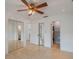 Bright bedroom featuring tile floors, mirrored closet doors, and access to a bathroom at 5967 Terrace Park N Dr # 202, St Petersburg, FL 33709