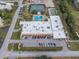 Aerial view showcases community center with tennis courts and pool and parking at 5967 Terrace Park N Dr # 202, St Petersburg, FL 33709