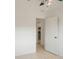 Hallway view leading to a bright kitchen area with an open doorway at 5967 Terrace Park N Dr # 202, St Petersburg, FL 33709