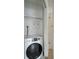 Modern white washer dryer in the laundry nook at 5967 Terrace Park N Dr # 202, St Petersburg, FL 33709