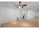 Bright living room featuring tile flooring, recessed lighting, a modern ceiling fan and a large mirror wall at 5967 Terrace Park N Dr # 202, St Petersburg, FL 33709