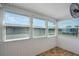 Bright sunroom featuring a fan and plenty of natural light at 5967 Terrace Park N Dr # 202, St Petersburg, FL 33709