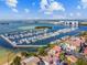Expansive marina with numerous boats docked alongside waterfront homes with red-tiled roofs and lush greenery at 6030 Printery St # 108, Tampa, FL 33616