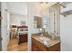 Bathroom featuring granite vanity, tub-shower and hardwood flooring at 6030 Printery St # 108, Tampa, FL 33616