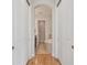 Hall view of bathroom featuring tile flooring, soaking tub, and arched doorway at 6030 Printery St # 108, Tampa, FL 33616