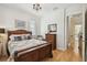 Bedroom with wood flooring, chandelier, and natural light at 6030 Printery St # 108, Tampa, FL 33616