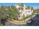 Charming multi-story townhome boasts a light-colored exterior, lush landscaping, and a welcoming neighborhood setting at 6030 Printery St # 108, Tampa, FL 33616