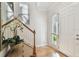Bright foyer featuring hardwood floors, staircase, front door and natural light at 6030 Printery St # 108, Tampa, FL 33616