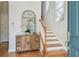 Bright foyer featuring hardwood floors, staircase, mirror and natural light at 6030 Printery St # 108, Tampa, FL 33616