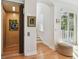 Bright home interior featuring an elevator, stairs, and views of a balcony at 6030 Printery St # 108, Tampa, FL 33616