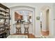 Kitchen bar with seating, wooden cabinets, stainless appliances and lots of light at 6030 Printery St # 108, Tampa, FL 33616