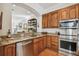 Kitchen with granite countertops, stainless steel appliances, and ample cabinet space at 6030 Printery St # 108, Tampa, FL 33616