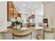Kitchen bar featuring granite countertops, wooden cabinets, and bright dining area at 6030 Printery St # 108, Tampa, FL 33616