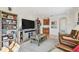 Inviting living room with built-in shelving, hardwood floors, and a large window at 6030 Printery St # 108, Tampa, FL 33616