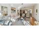Open-concept living room featuring stylish furniture, hardwood floors, and lots of natural light at 6030 Printery St # 108, Tampa, FL 33616