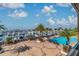 Scenic view of the pool and marina with boats docked and palm trees lining the area at 6030 Printery St # 108, Tampa, FL 33616