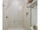 Modern bathroom shower with neutral-toned tile and glass door at 6030 Printery St # 108, Tampa, FL 33616