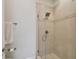 Bathroom shower featuring glass door, tiled walls, and rainfall shower head at 6030 Printery St # 108, Tampa, FL 33616
