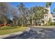 Exterior view of community featuring lush landscaping and tree-lined street at 6030 Printery St # 108, Tampa, FL 33616