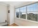 Bright window view overlooking mature trees and clear blue sky at 6030 Printery St # 108, Tampa, FL 33616