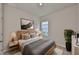Relaxing bedroom featuring simple wooden accents and natural lighting at 6042 Golden Nettle Dr, Apollo Beach, FL 33572