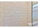 Close-up of a modern shower with white subway tile and glass enclosure at 6042 Golden Nettle Dr, Apollo Beach, FL 33572