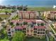 Expansive aerial view of the residences near the beach, featuring rooftop terraces and scenic water vistas at 6411 Mayra Shores Ln, Apollo Beach, FL 33572
