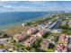 An aerial view of a waterfront condo community with boat docks and stunning ocean views at 6411 Mayra Shores Ln, Apollo Beach, FL 33572