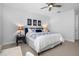 Bright bedroom featuring white walls, ceiling fan, and well-coordinated decor at 6411 Mayra Shores Ln, Apollo Beach, FL 33572